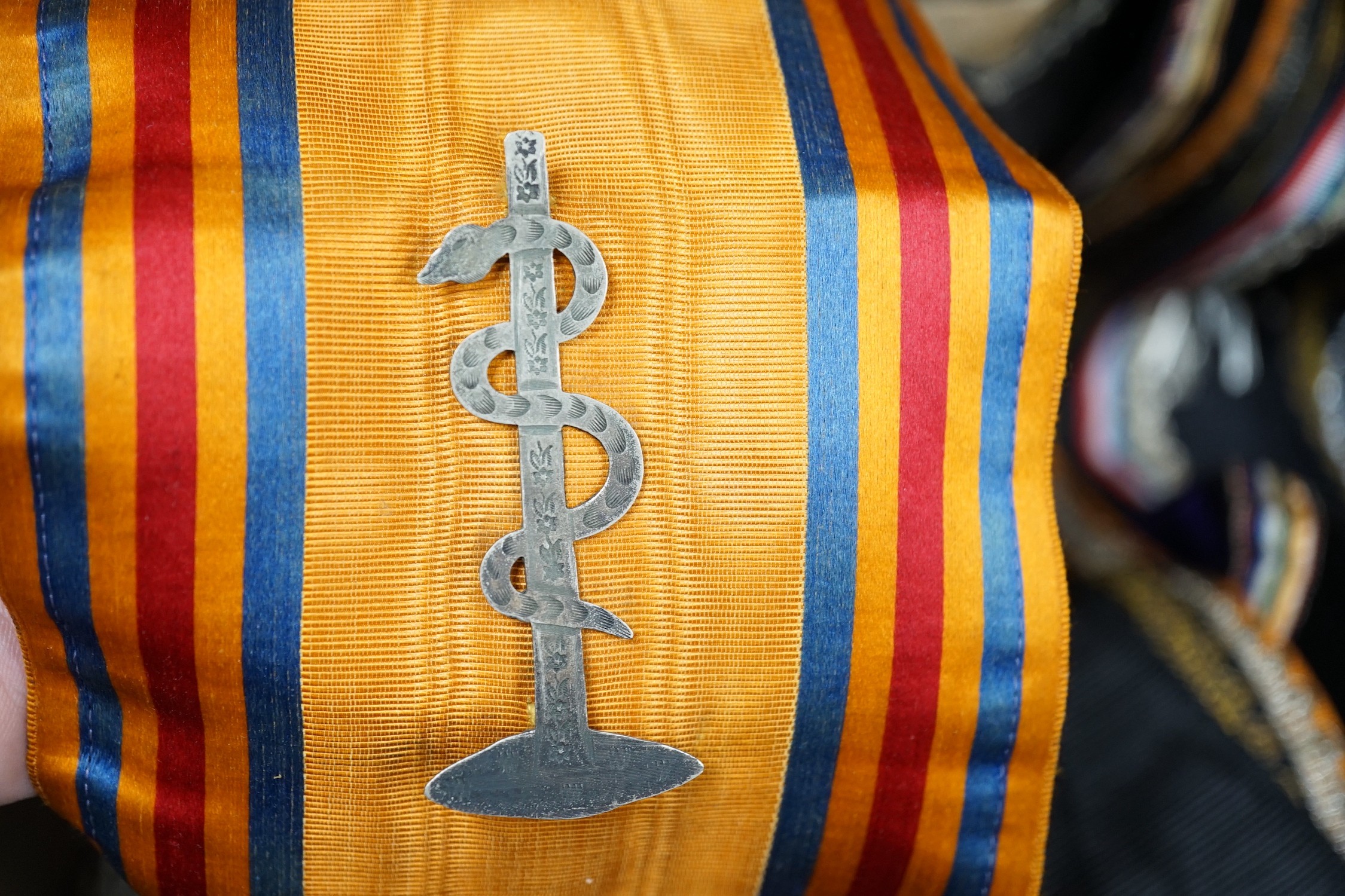 An Orange Order sash, seven Masonic sashes and two aprons